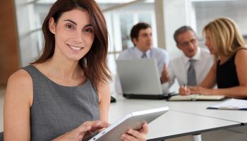 woman in an office holding tablet