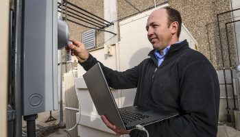 man holding laptop