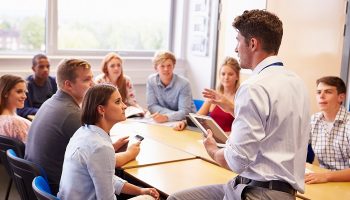 teacher talking to students