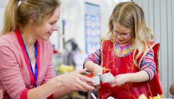child and her art teacher