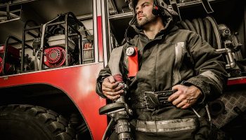 firefighter next to truck