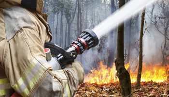 firefighter putting out fire