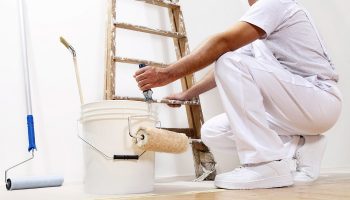 painter using a paint roller