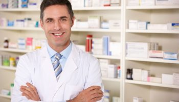pharmacist in front of a shelf