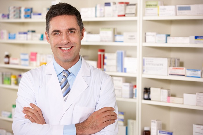 pharmacist in front of a shelf