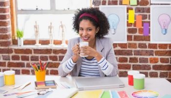interior designer smiling with coffee cup in hand