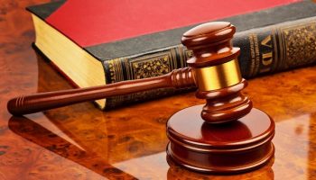 judge's gavel near a book